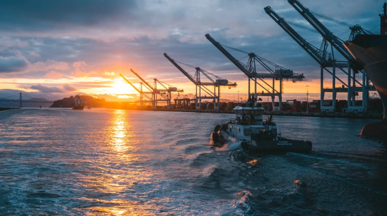 panoramic-shot-oil-rigs-sea-with-beautiful-sunset.webp