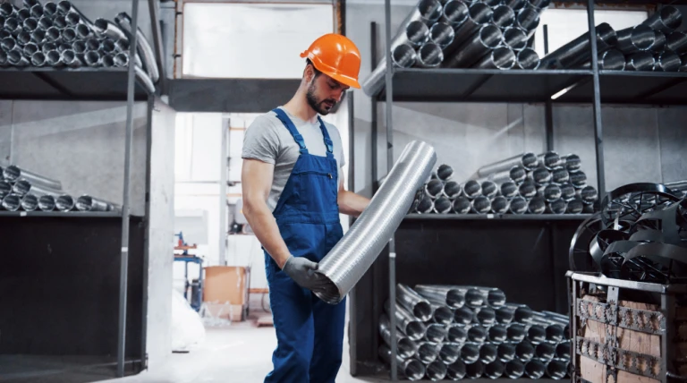 portrait-young-worker-hard-hat-large-metalworking-plant.webp