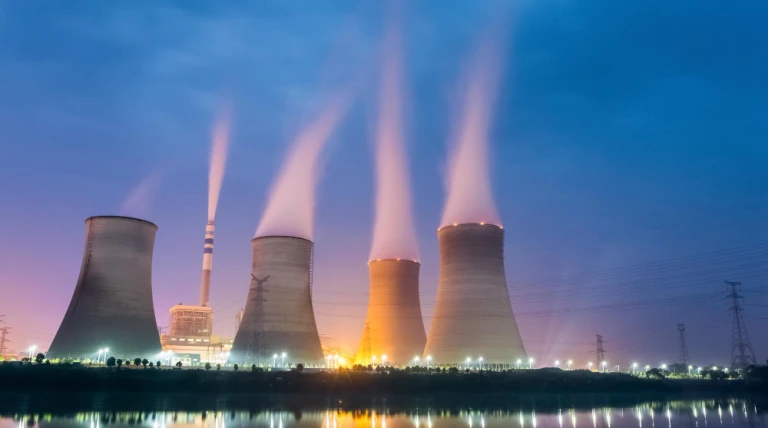 power-plant-night-cooling-tower-closeup-with-steam.webp