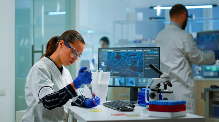 scientist-modern-equipped-medical-laboratory-examinining-drug-discovery-with-micropipette-medical-stuff-examining-vaccine-evolution-using-high-tech-technology-researching-treatment-developmen.webp