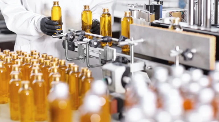 transparent-plastic-bottles-filled-with-yellow-substance.webp