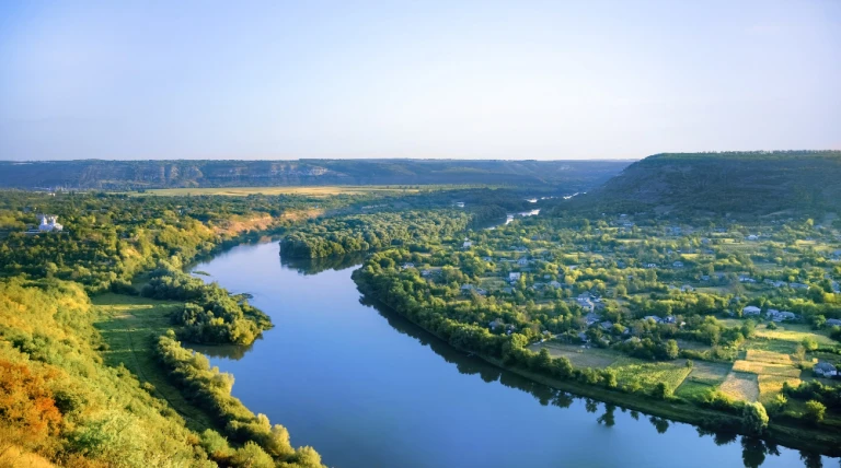 village-with-orthodox-church-river-dividing-into-two-parts.webp